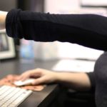 Woman pointing at computer screen